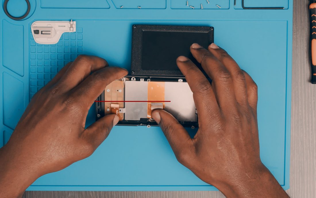 Roughly match the LCD and menu button cable lengths. Route the FPC with the tilt at full extension so it has slack to reach the connector and move freely.