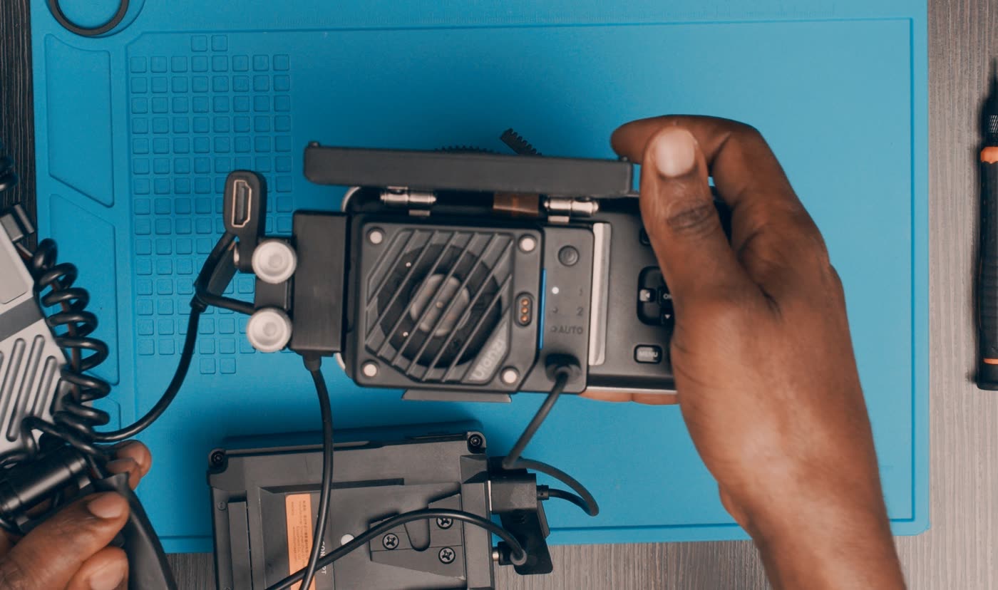 The aluminum backplate holds heat. The cooler mounts against the backplate and cools through the same path.